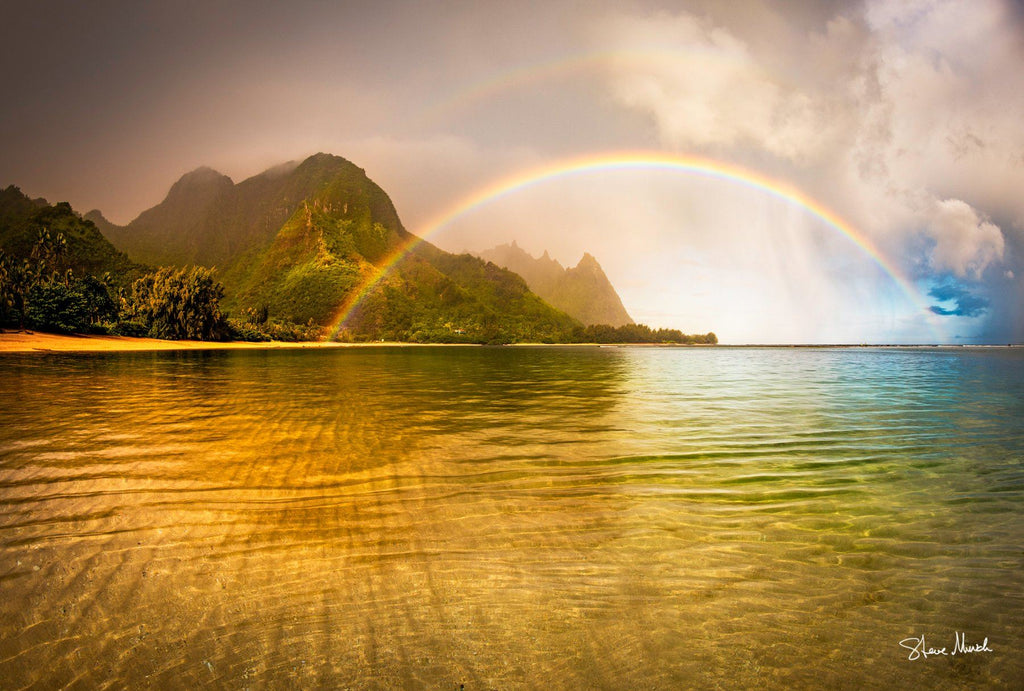 A surreal Rainbow over the ocean at Tunnels Beach in Hawaii.