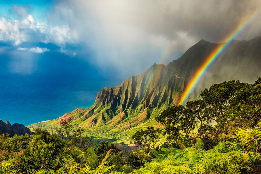 Sunset wall art of a rainbow piercing through the lush, jaw-droppingly beautiful Kalalau Valley on Kauai.