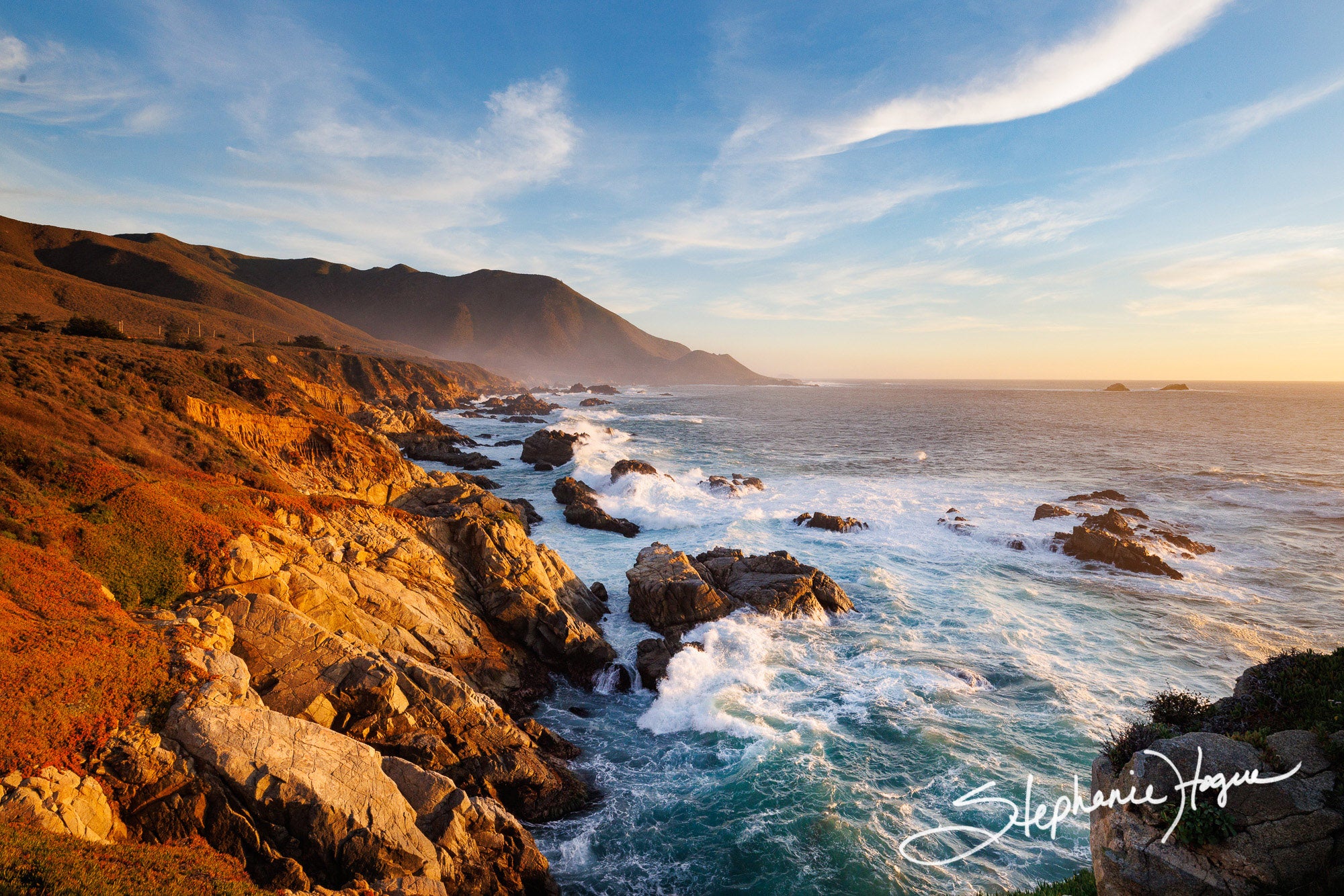 A soft sunset on the rocky coastline of Big Sur off of the iconic Pacific Coast Highway.