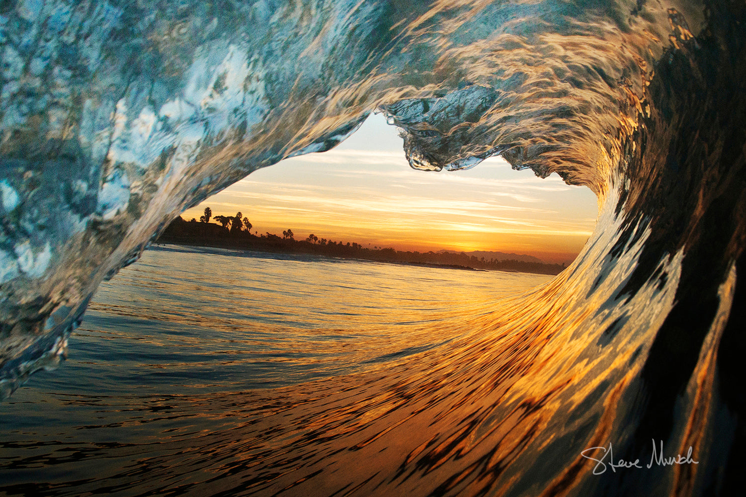Nature photograph taken from inside the barrel of a stunning glassy ocean wave.